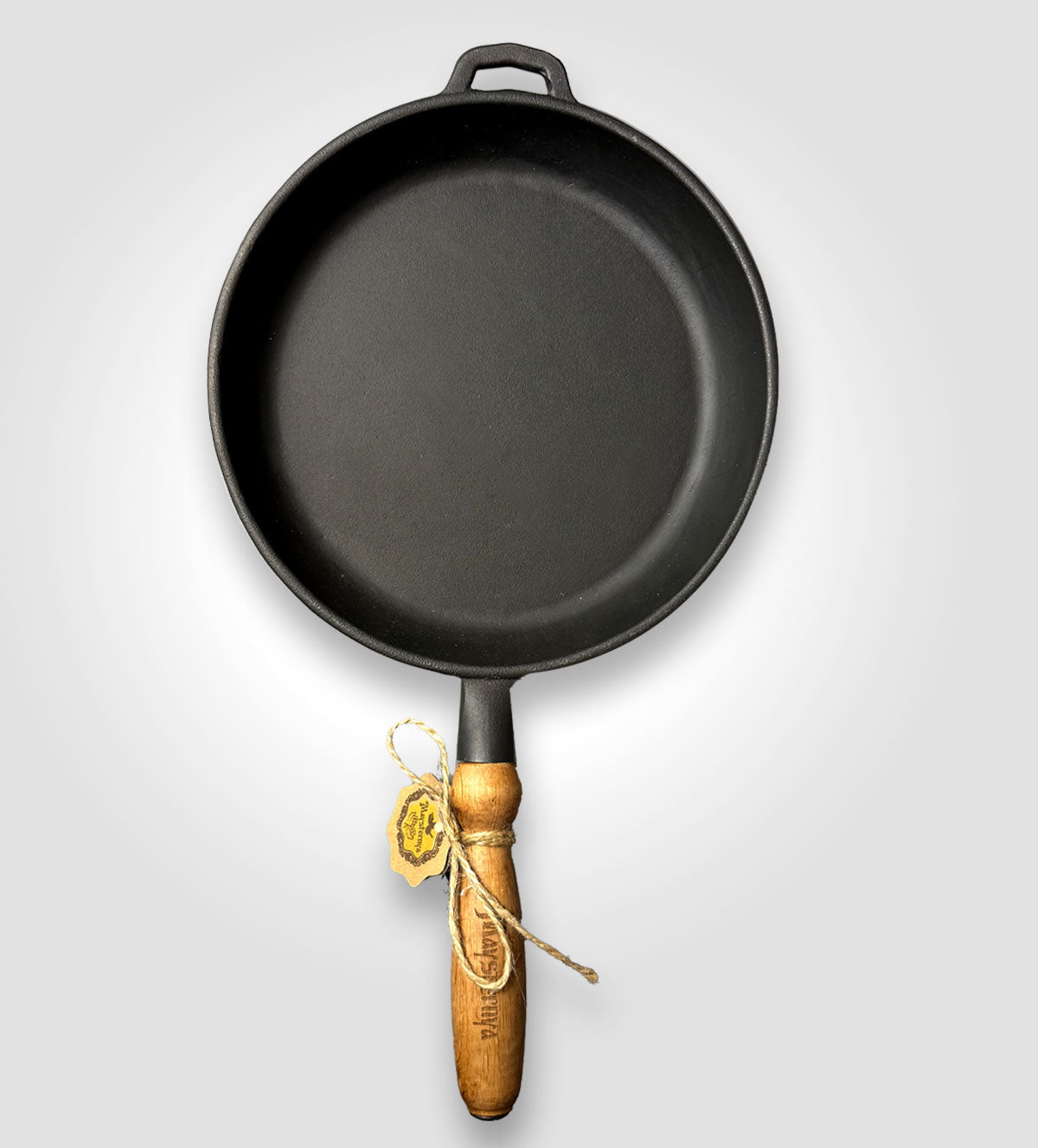 Gusseisenpfanne mit Holzgriff.