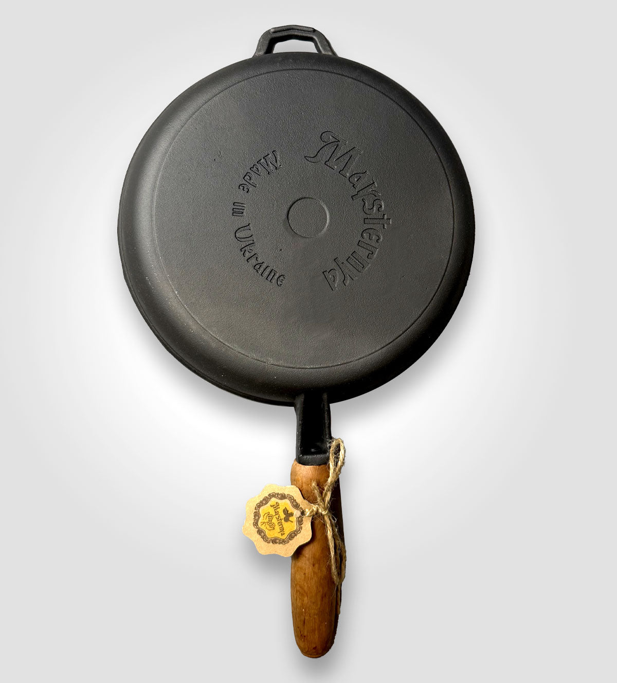 Gusseisenpfanne mit Holzgriff.